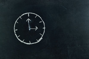 image of clock drawn on chalkboard for article about how long a certificate of good standing is good for